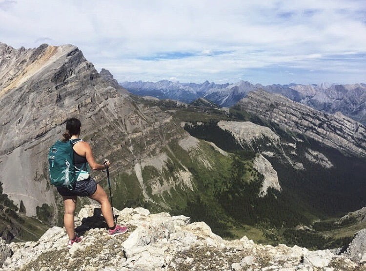 Lady standing in Harvey Pass. Part of the Lake Bourgeau hike. 5 Best Hikes: Banff, Alberta