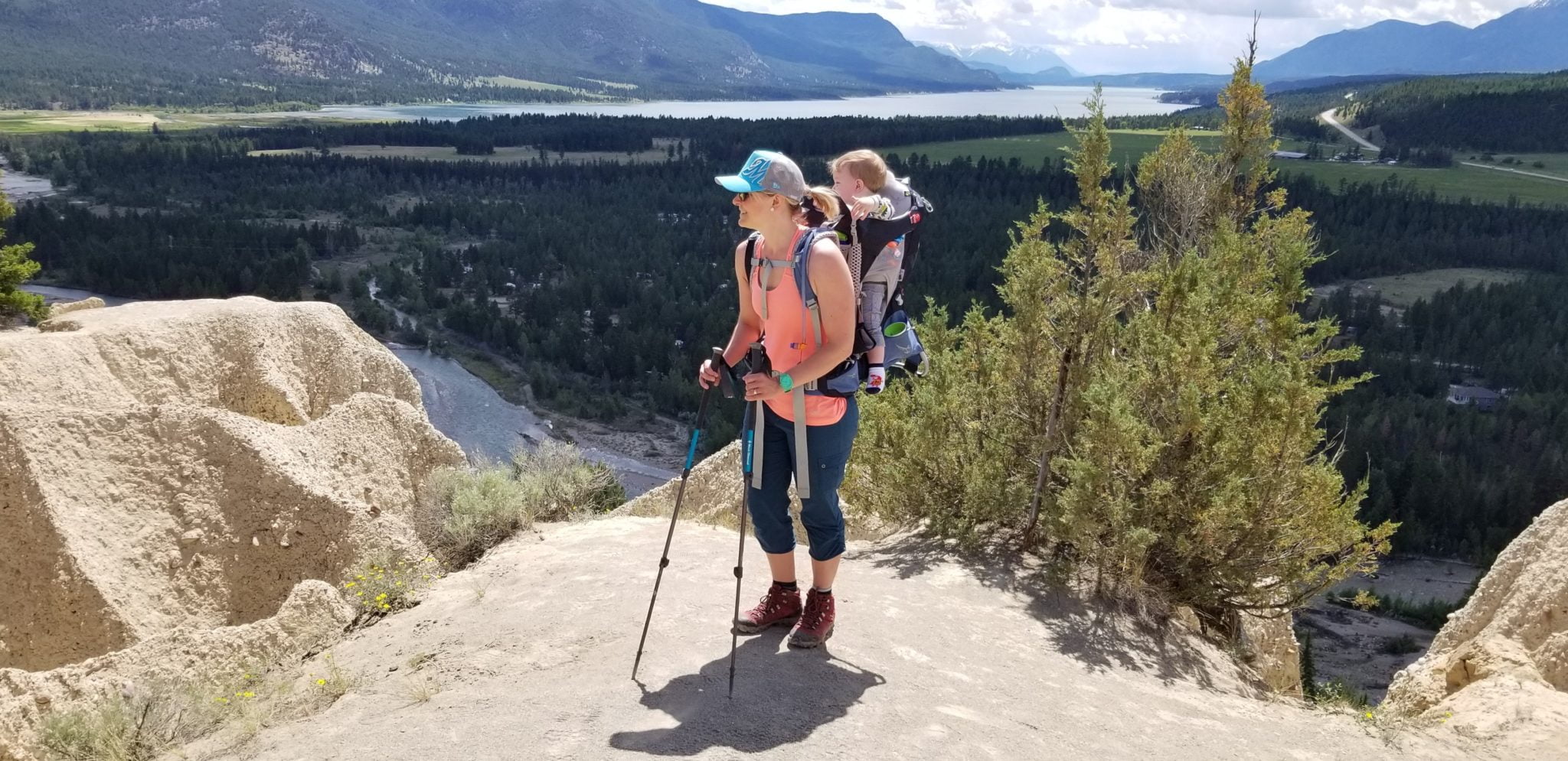 A woman hiking with a baby backpack