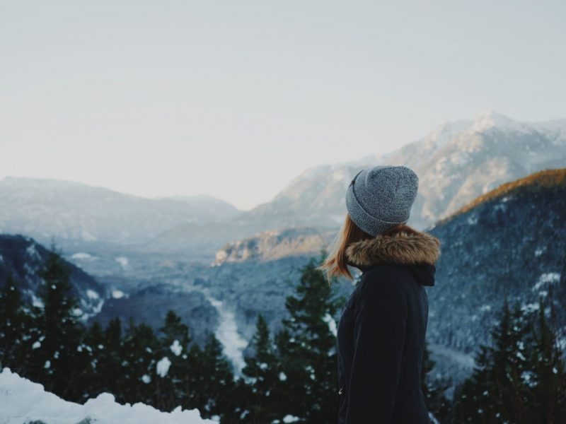 Girl Looking Out Over A Snowy Landscape