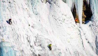 A Group Of Ice Climbers At Ice Fields Parkway In Alberta