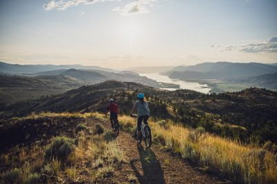 Two People Riding Mountain Bikes In Kamloops, BC