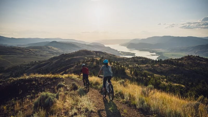 Two People Riding Mountain Bikes In Kamloops, BC
