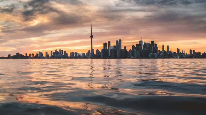 A Lake And The Toronto City Skyline.