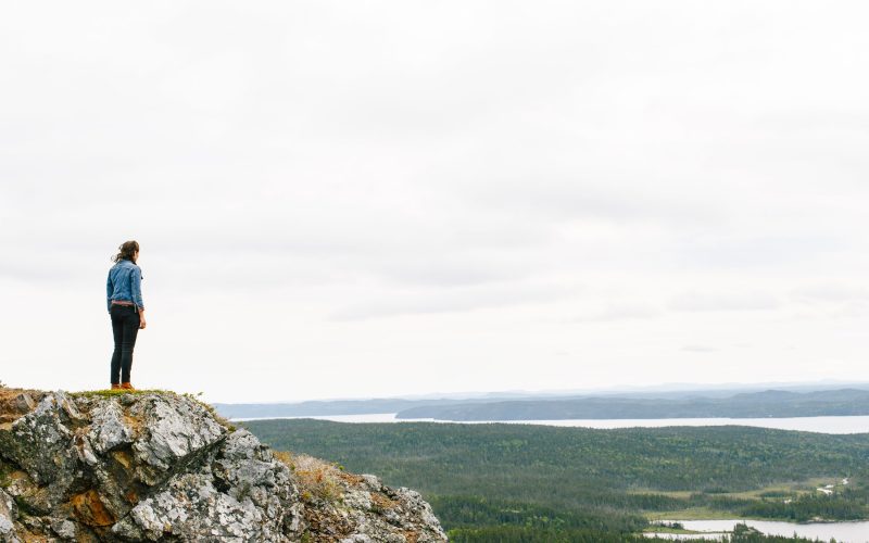 women on cliff overlooking view of Terra Nova, Newfoundland